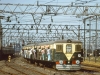 An electrical multiple unit leaving Howrah station Calcutta on 20 December 1980.  Many passengers prefer to hang on to the outside of the train rather than be crowded inside.