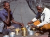 Two men enjoying a meal together, doubtless prepared by their wives, and make no objection when a foreigner wants to point his camera at them. Ajmer18 January 1981.